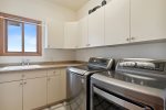 Separate laundry area with high quality appliances 